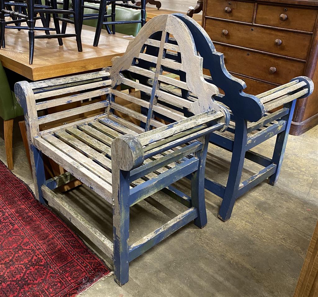 A pair of Lutyens style weathered teak garden chairs, width 94cm, depth 62cm, height 104cm